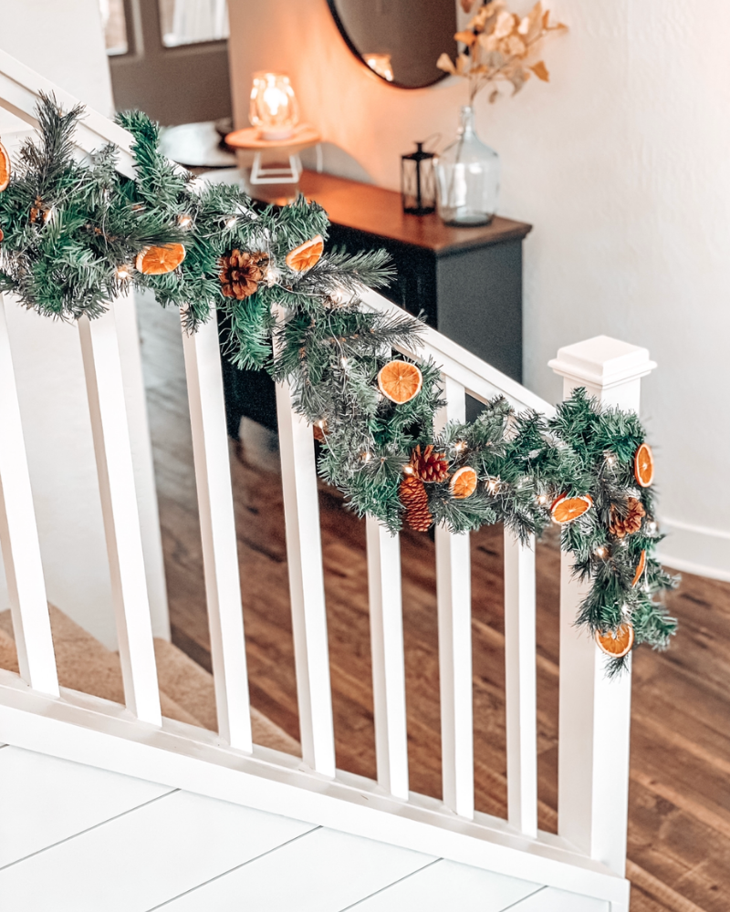 decorated staircase banister christmas garland dried orange garland
