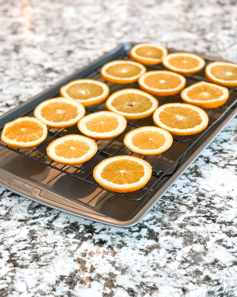 place orange slices on cookie sheet